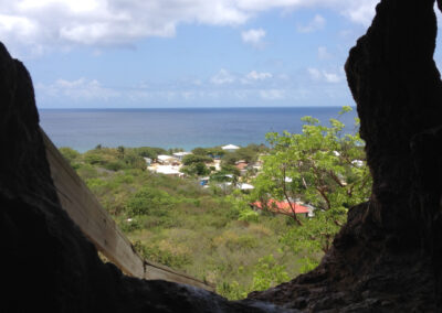 C is for Cayman Brac. This is one on the sister islands of the Caymans. It lies 100 miles away from the main island of Grand Cayman but in other terms thousands of miles away from the offshore accounts, shell companies, money laundering of Grand Cayman. Small and peaceful a nature lovers paradise. This is the view from Peter's cave, traditionally used as a hurricane shelter.