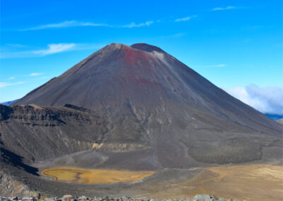 N - New Zealand - or really we should call it by its Maori name Aotearoa. This is the volcano of Mt. Ngauruhoe, sacred to the Maoris. It was used as Mt Doom for the filming of Lord of the Rings.